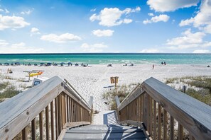 A wooden boardwalk leading to a beach with clear skies and calm waters. -  GULF FRONT on 30A with Beach setup! (Santa Rosa Beach)