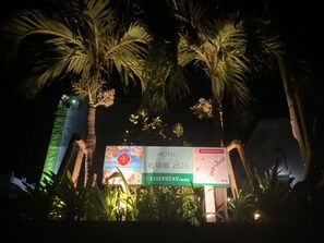 A hotel sign with 'HOTEL' and 'COZYSTAY' branding, surrounded by palm trees. - HOTEL Ishigakijima 2020 (Ishigaki)