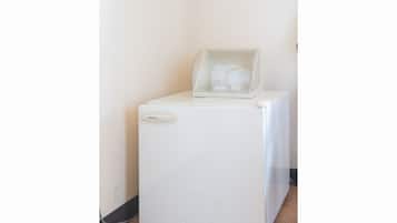 A white, compact refrigerator with a 'National' label and a 'fellow's box' on top.