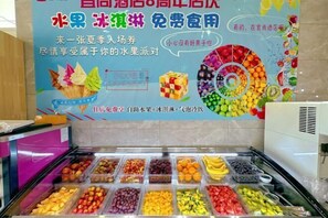 A buffet area with various fruits and desserts. - Echarm Hotel (Beijing Yizhuang) (Beijing)