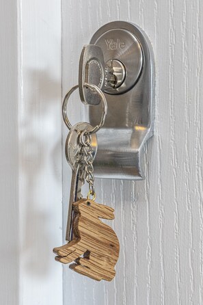 A Yale door lock with a keychain attached. - The Sleep-Inn Hare (Herne Bay)