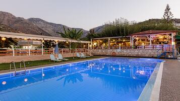 Seasonal outdoor pool, pool umbrellas, pool loungers