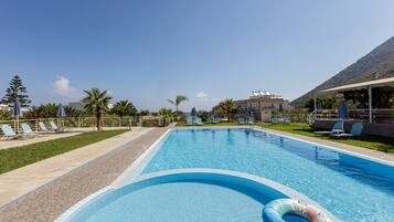 Seasonal outdoor pool, pool umbrellas, pool loungers