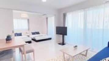 1 Bedroom Apartment with Balcony 203 | Living area | 40-inch flat-screen TV with digital channels, TV