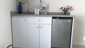 A compact kitchen with a microwave, toaster, coffee maker, and refrigerator. - Villa Azul - With a Jetted tub Villa 3 (savaneta)