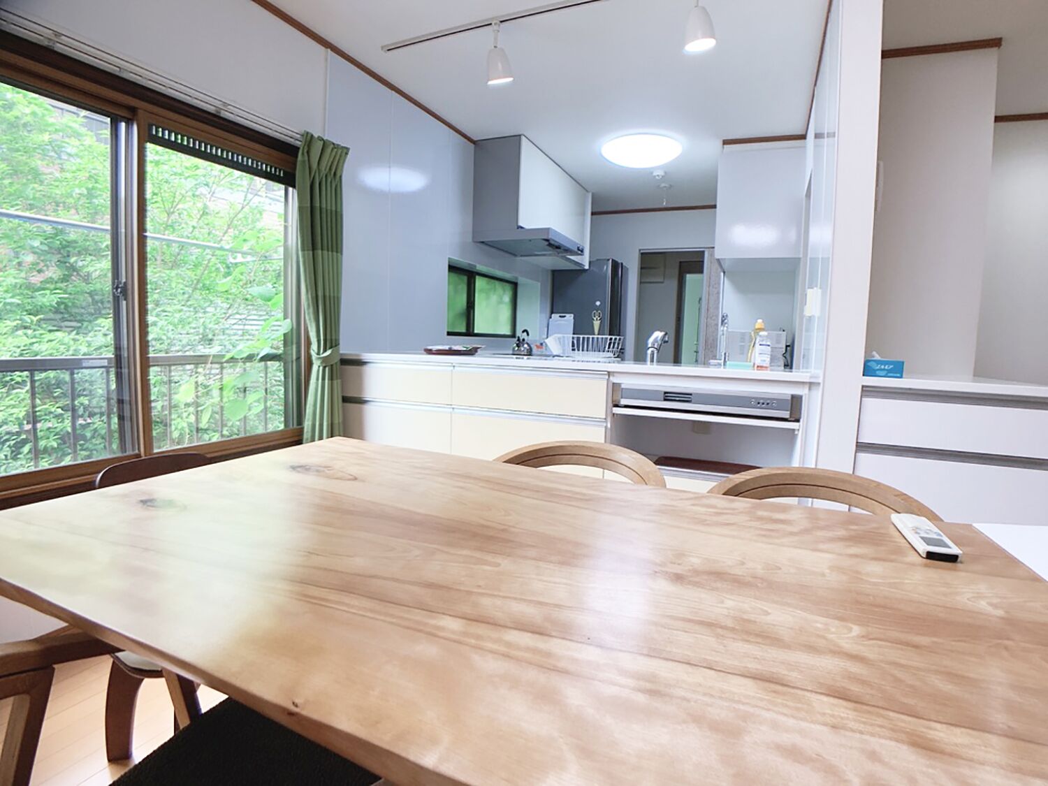 A modern kitchen with a dining area.
