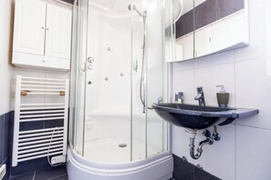 Shower, hair dryer, towels, soap