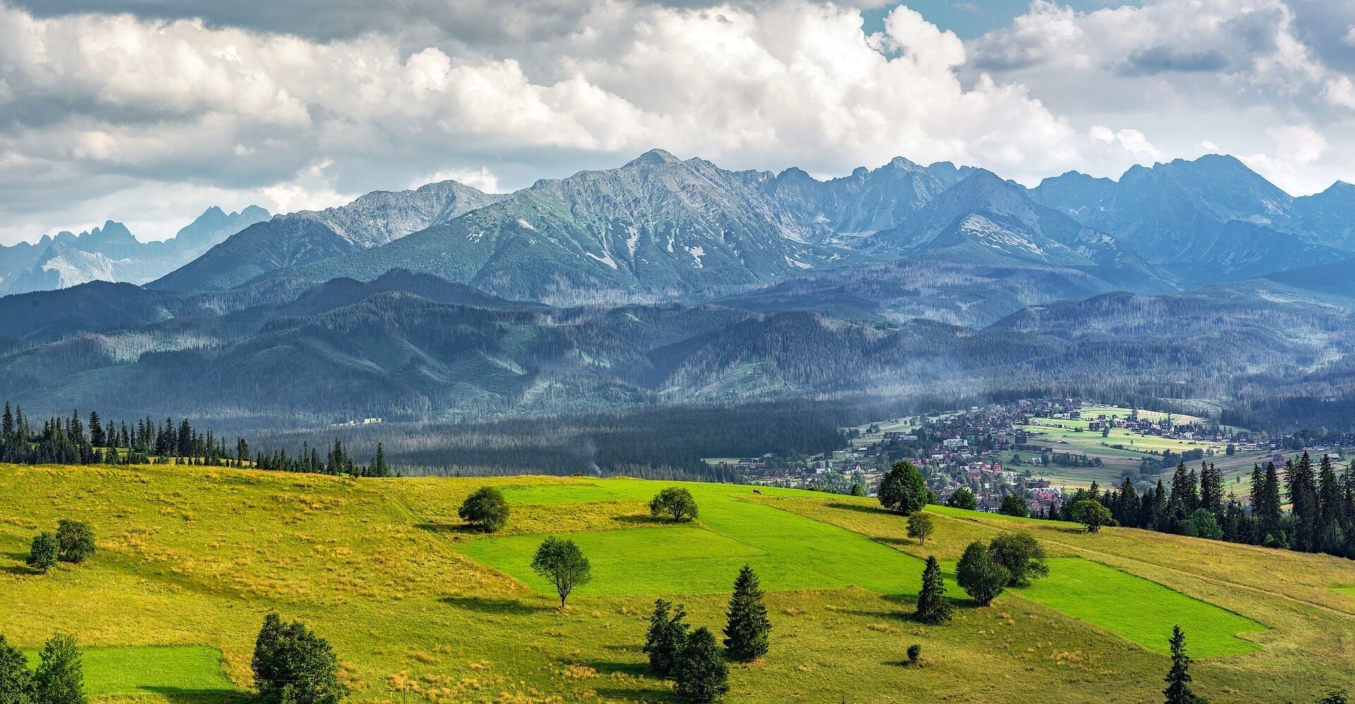 A mountainous landscape with a town nestled in the valley.
