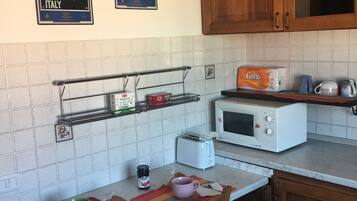 Apartment | Private kitchen | Fridge, microwave, oven, stovetop