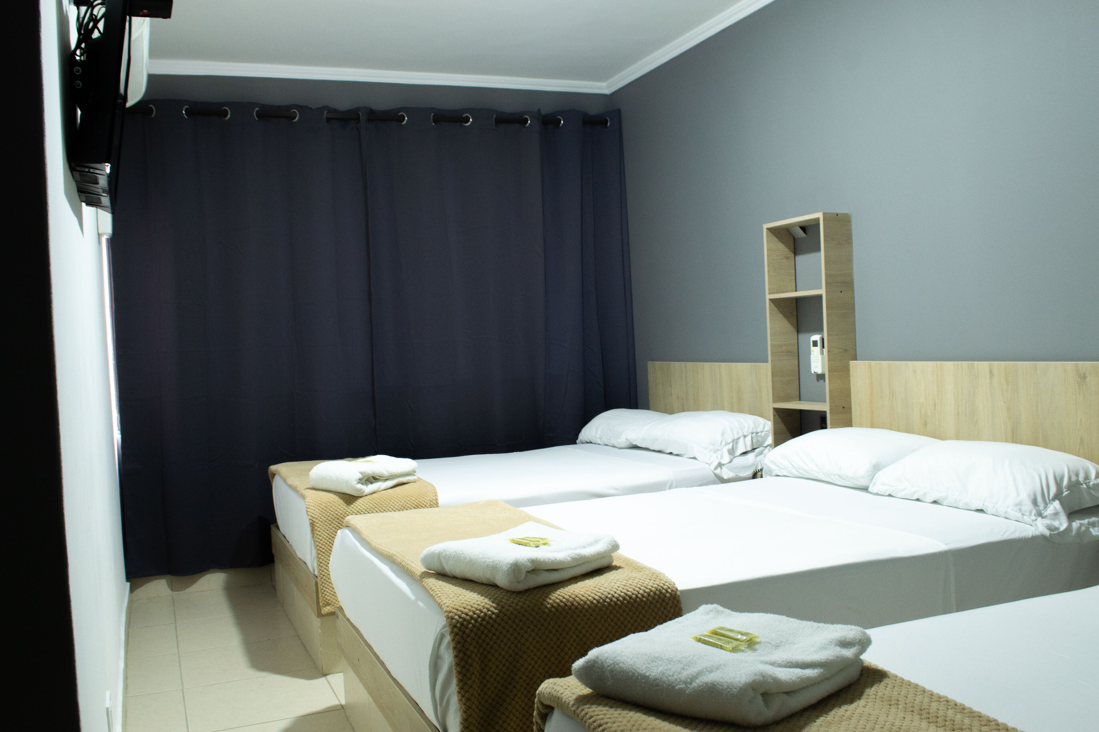 Standard Triple Room | Minibar, desk, laptop workspace, soundproofing