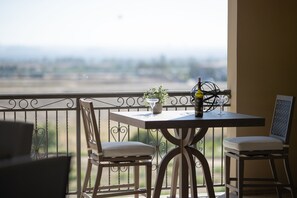 Enjoy a romantic dinner for two on this balcony with a scenic view.
