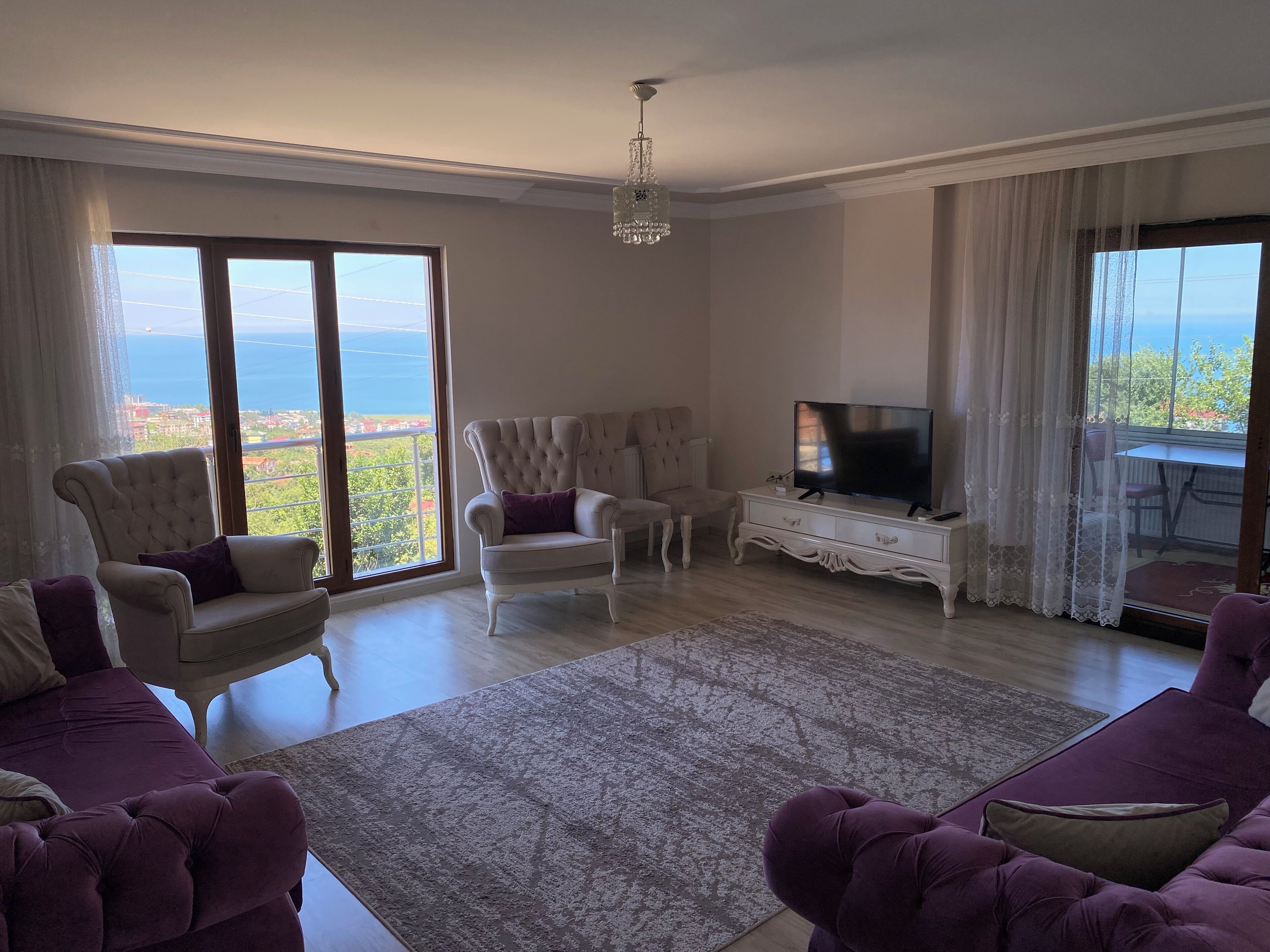 Family Apartment, 4 Bedrooms | Living area | LCD TV