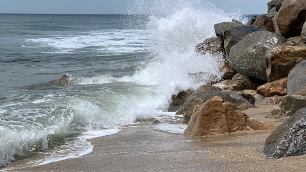 A beach with large rocks and waves crashing onto the shore. - Let the Sea Set You Free (South Kingstown)