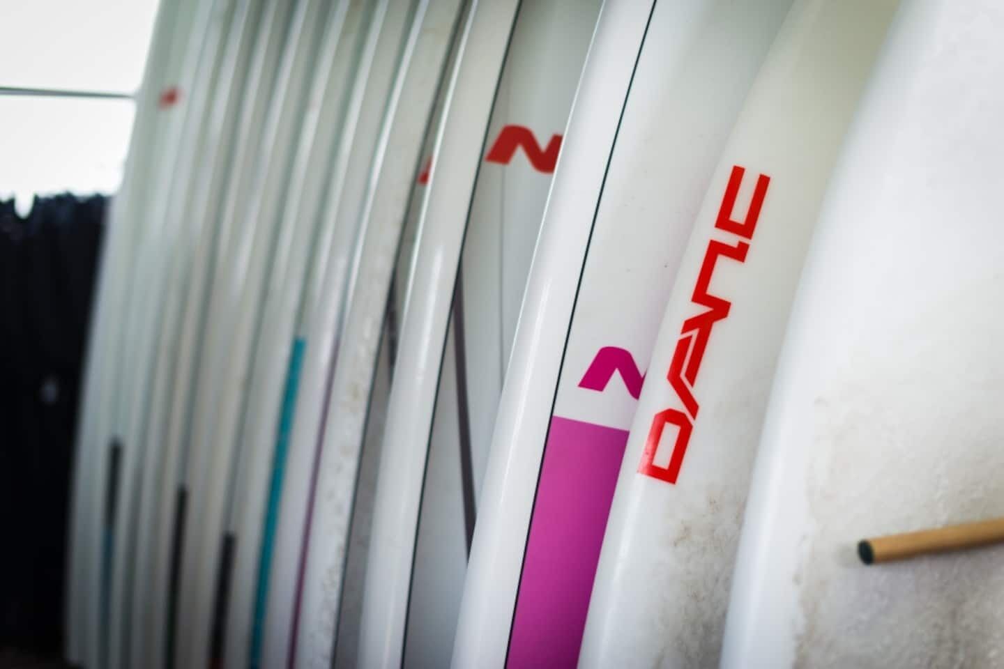 A row of white cylindrical objects with red text and numbers.