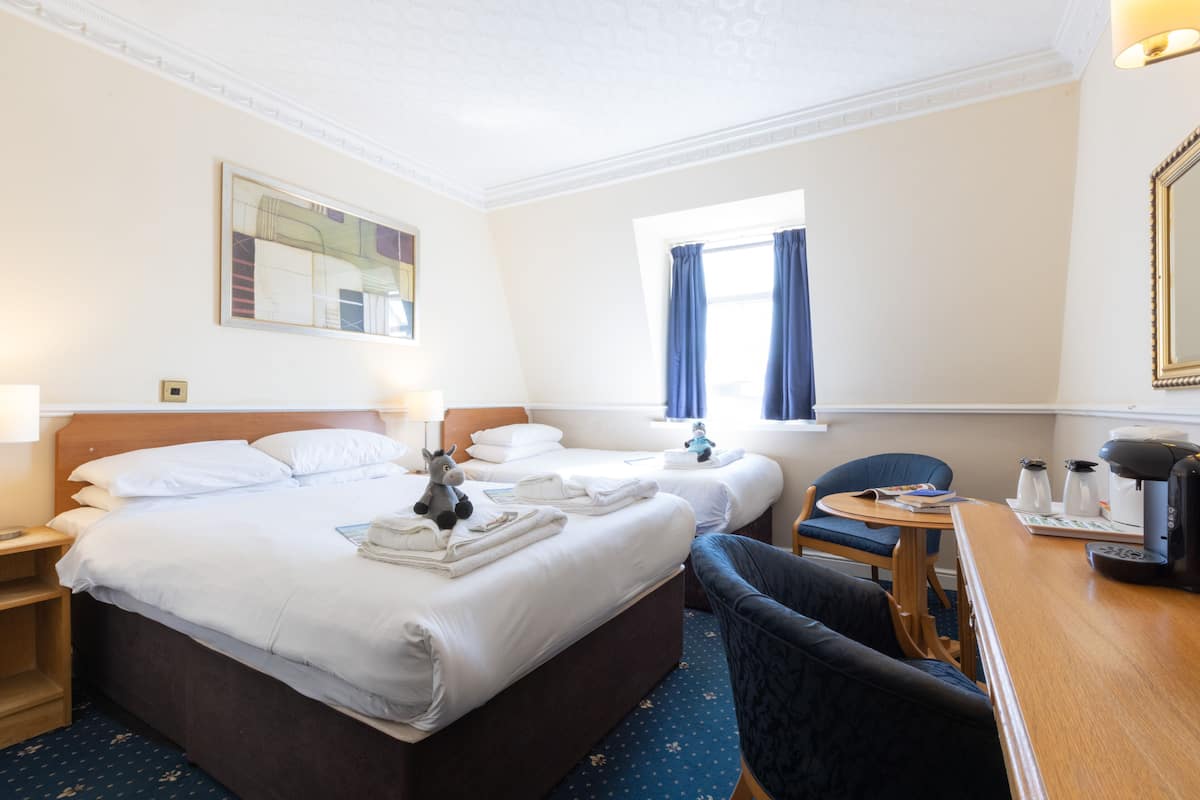 Family Triple Room | Iron/ironing board, bed sheets