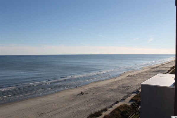On the beach, sun-loungers