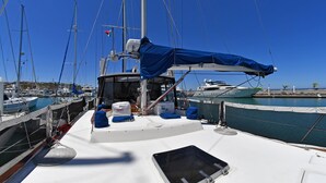 A sailboat docked at a marina with a clear blue sky. - The ultimate sailing yacht vacation in the Sea of Cortez. Jersey Girl II  (La Paz)