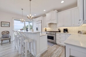 Fridge, microwave, stovetop, dishwasher - Beach Trail House – Gulf-Front Luxury w/ Heated Pool, Game Room, Sunset Balconies & Beach Access (Indian Rocks Beach)