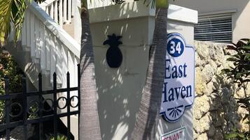 A street sign for '34 East Haven' with a 'Tenant Parking Only' sign below it.