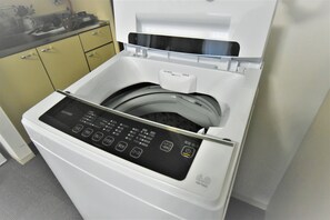 Efficient laundry facilities with a digital control panel.