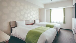 A hotel room with two beds, a TV, and a window with curtains. - Kuretake Inn Premium Meieki Minami (Nagoya)