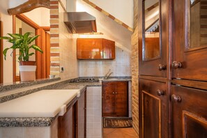 Fridge, stovetop, coffee/tea maker, cookware/dishes/utensils