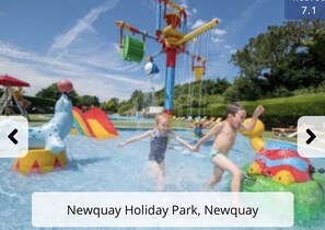 Enjoy the thrill of the water slide and wave machine at our outdoor water play area.