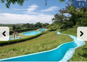 Enjoy a serene escape amidst lush greenery and a tranquil water feature.