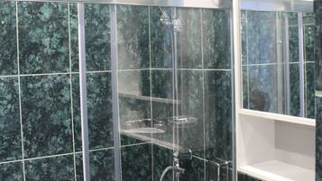 Shower, hair dryer, towels, soap