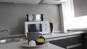 Fridge, microwave, coffee/tea maker, toaster