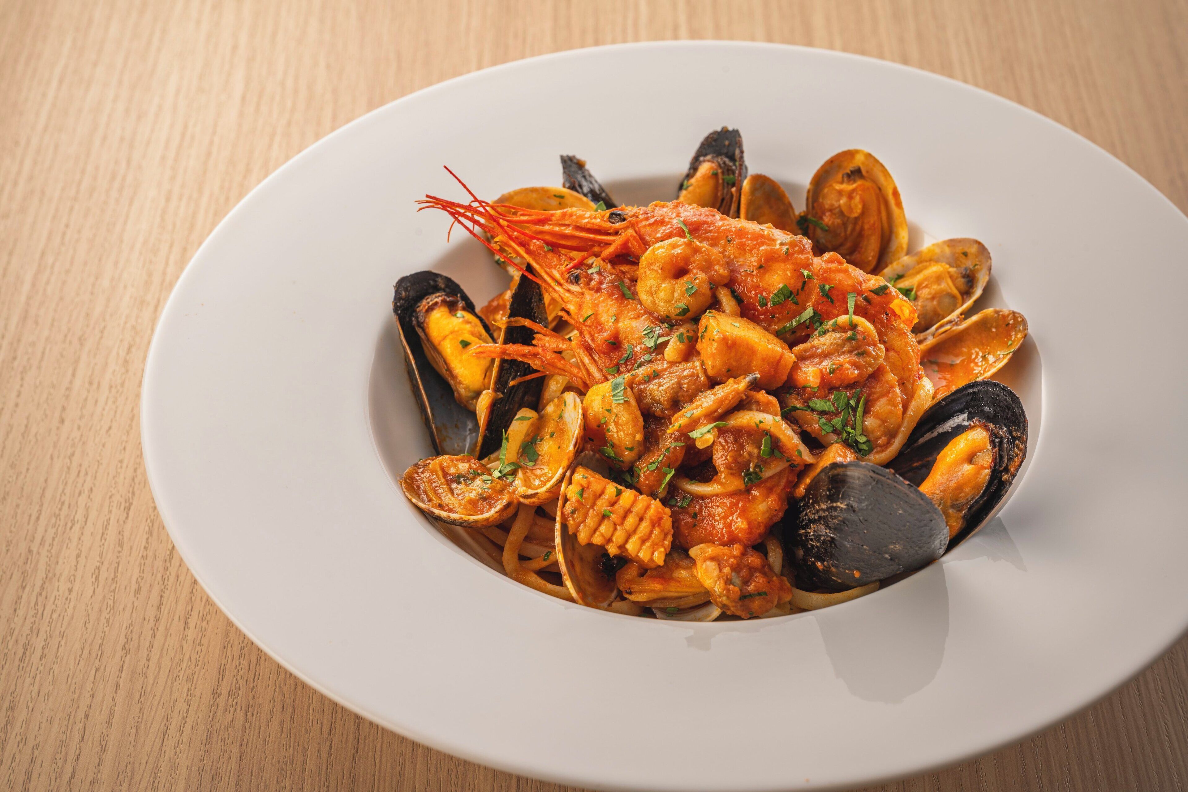 A seafood dish on a white plate.