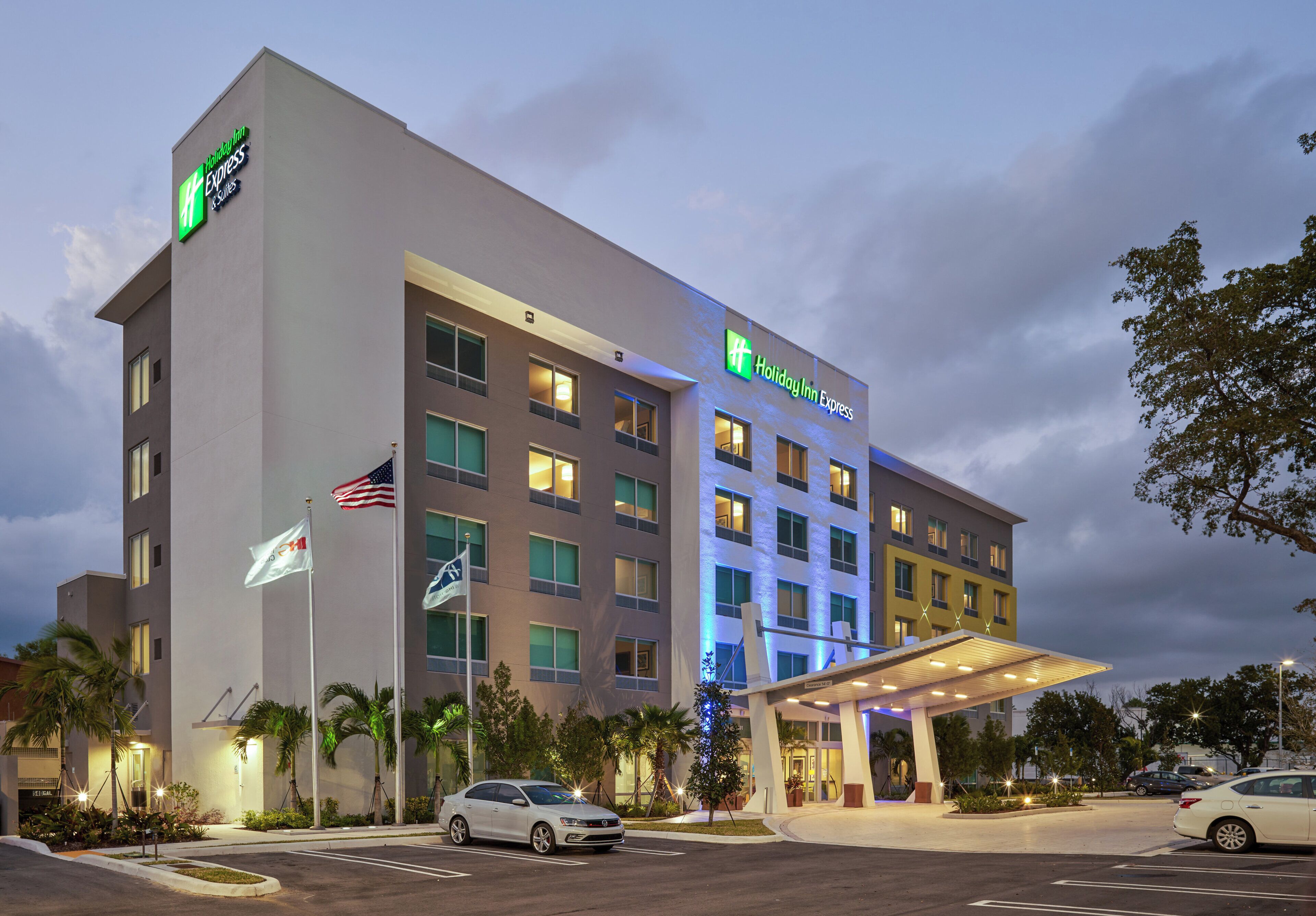 A Holiday Inn Express hotel with a modern facade, multiple floors, and a covered entrance.