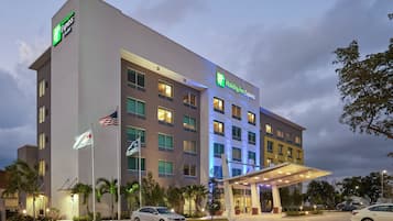 A Holiday Inn Express hotel with a modern facade, multiple floors, and a covered entrance.