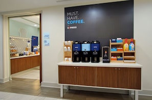 A coffee station with multiple coffee makers and a sign that reads "MUST. HAVE. COFFEE." - Holiday Inn Express Doral Miami by IHG (Miami)