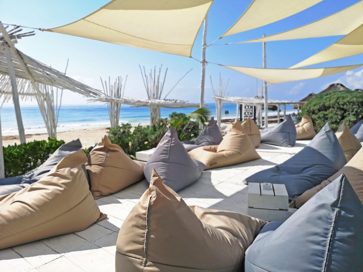 sun lounges on the beach in CoCo Tulum