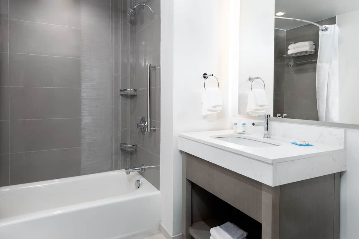 room, 2 queen beds (den) | bathroom | free toiletries, hair dryer, towels