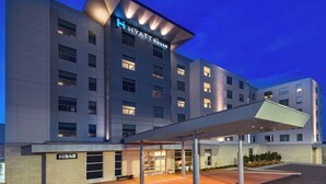 A modern hotel with a covered entrance, multiple floors, and a prominent 'Hyatt House' sign. - Hyatt House Tampa Airport Westshore (Tampa)