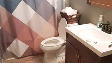 Bathtub, towels, soap, shampoo