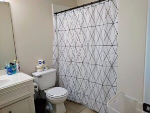 Separate bathtub and shower, hair dryer, towels, soap