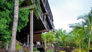 A staircase leading to a building with a palm tree and a turtle statue. - Spectacular Panoramic Ocean Views - Private Ohana - Wailea Custom Pole Home (Kihei)