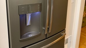 A stainless steel refrigerator with a water dispenser and a freezer compartment. - Pleasant Street Suite in downtown Prescott (Prescott)