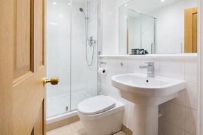 Bathtub, hair dryer, towels, soap
