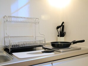Fridge, microwave, stovetop, cookware/dishes/utensils