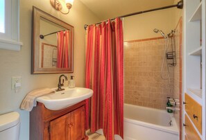 Combined shower/bathtub, hair dryer, towels, soap