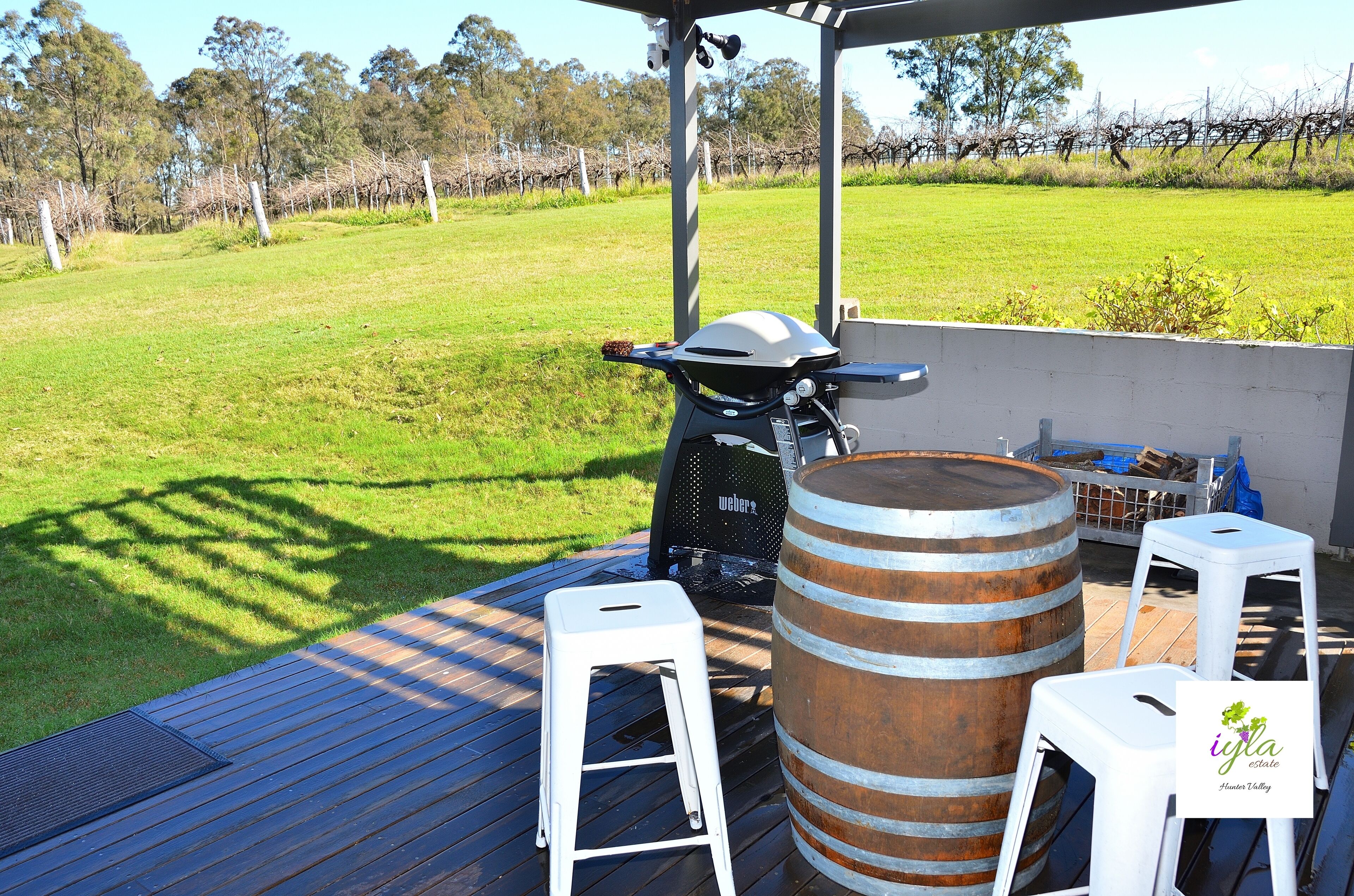 Outdoor extra seating with gas fired Weber BBQ & views of the vines & mountains