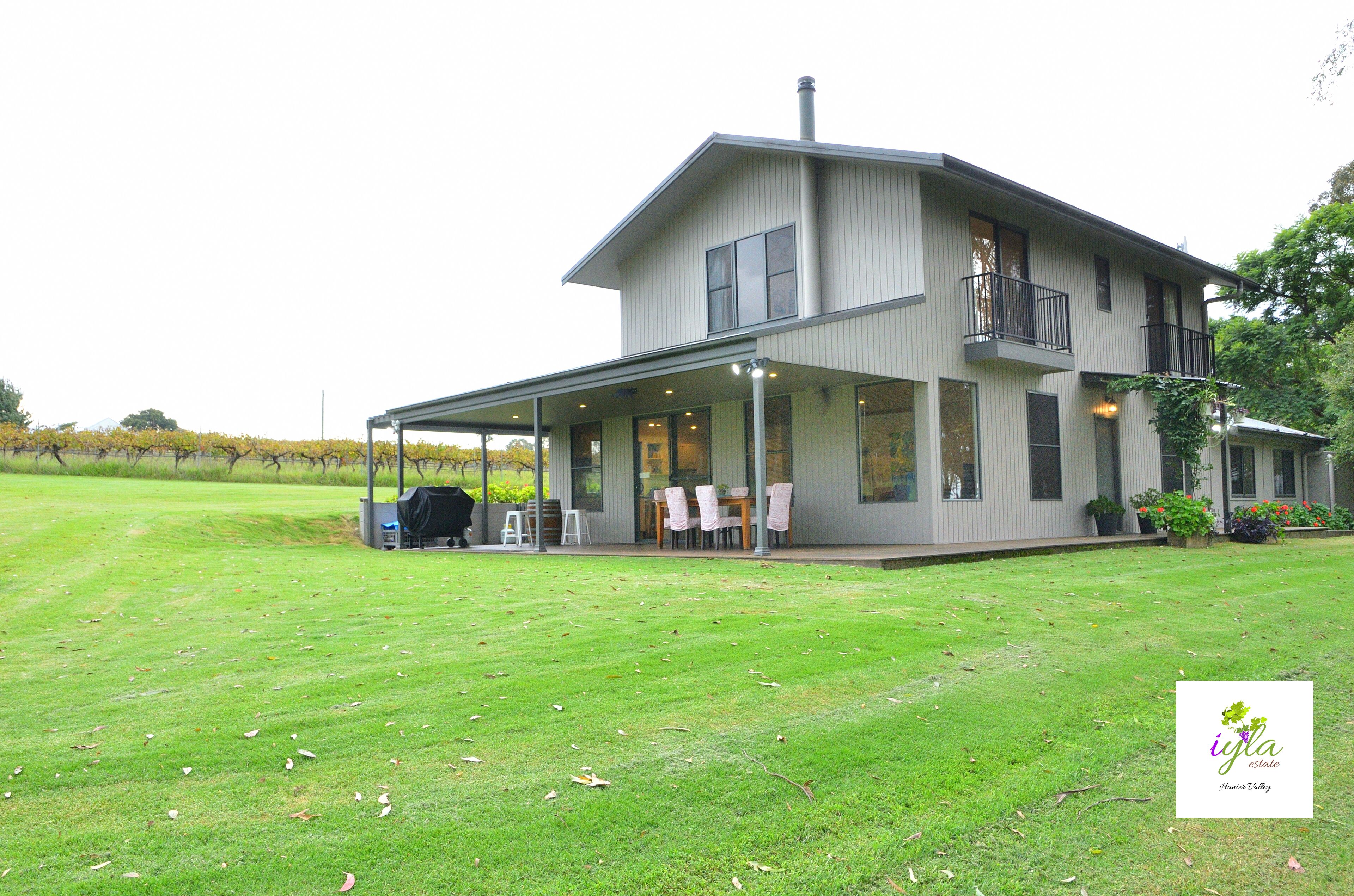 Outdoor entertaining space with views of the vines and mountains