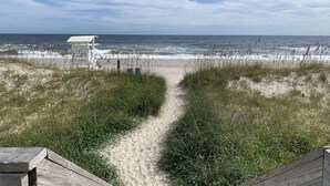A sandy beach path leading to a white beach hut. - MODERN Beach Home! Dogs Welcome! 6 Passenger Golf Cart & Free Town of CB Parking (Carolina Beach)