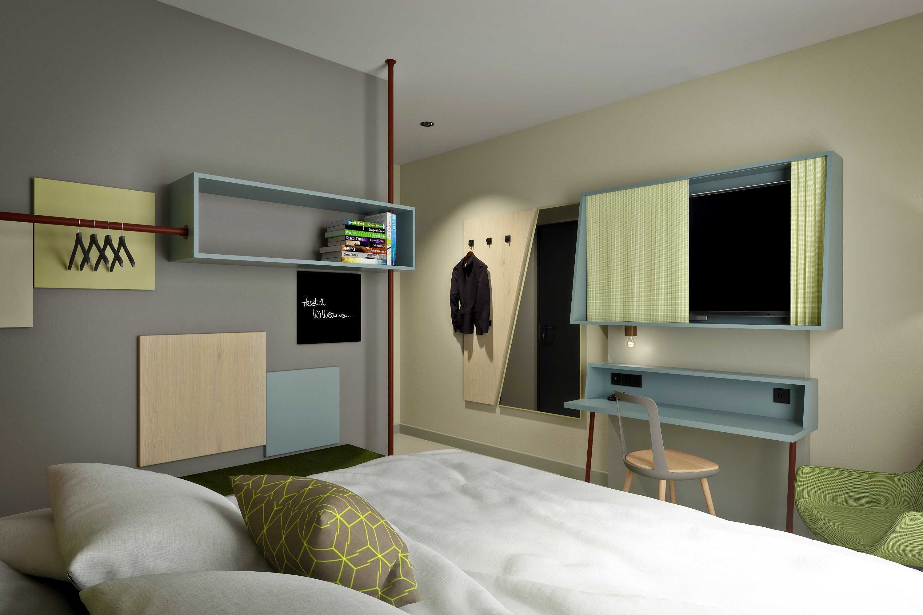Un dormitorio moderno con cama, escritorio, silla y armario.