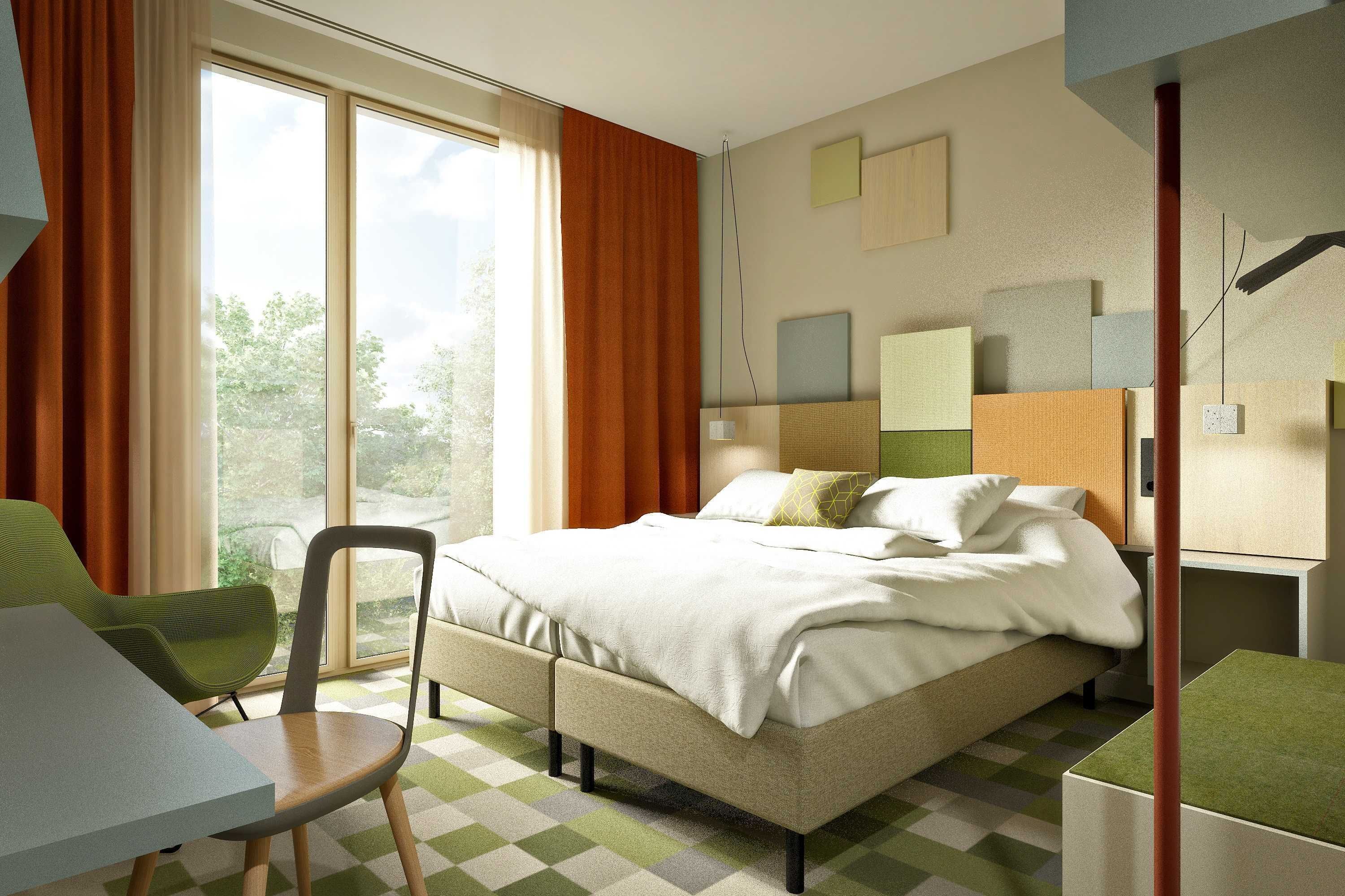 A modern hotel room with a bed, a desk, and a chair.
