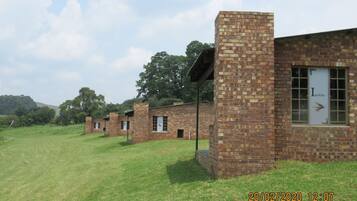 A row of brick buildings with a sign reading "Invicta" on one of them.